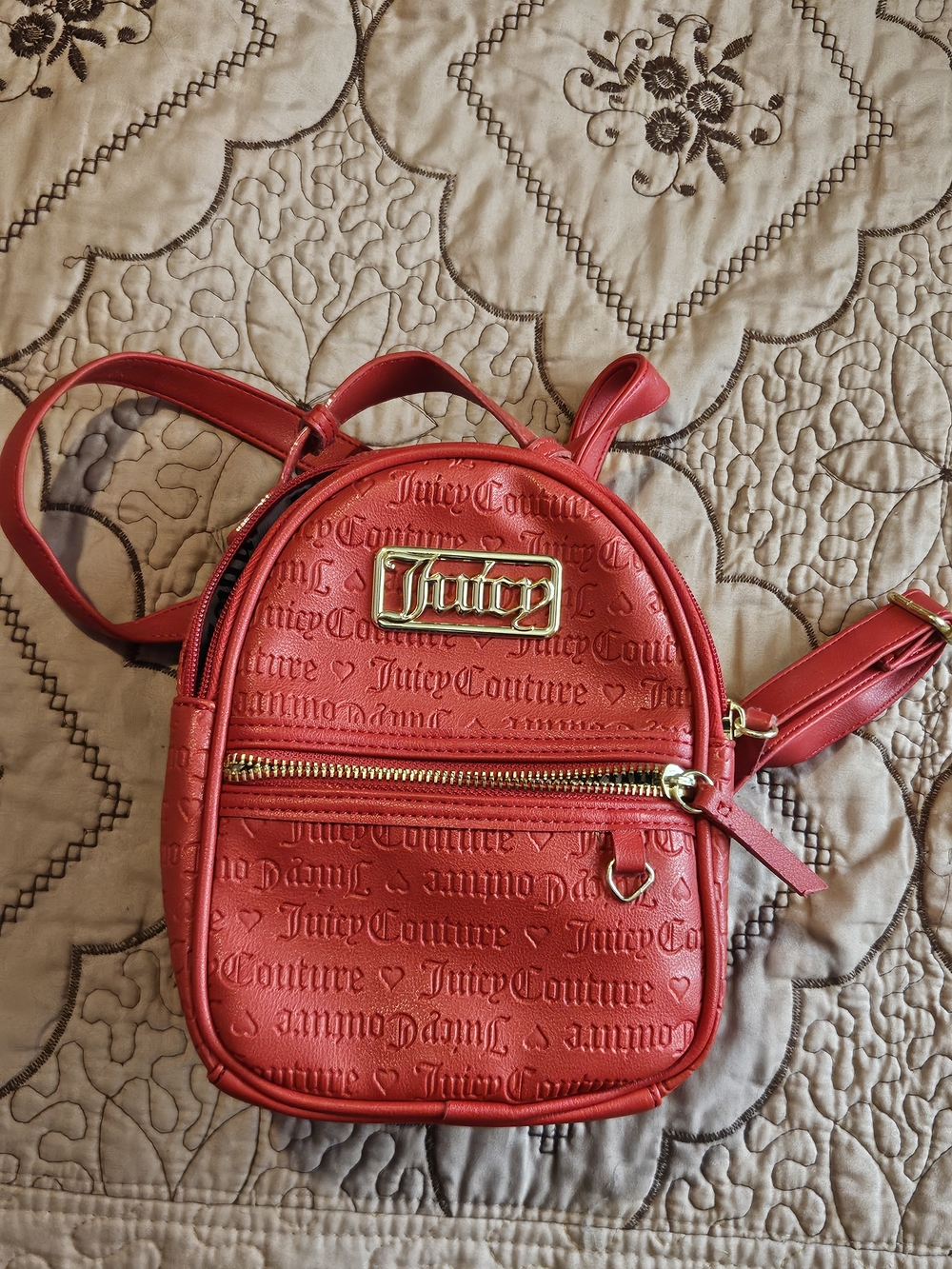 juicy couture red mini backpack with gold designs